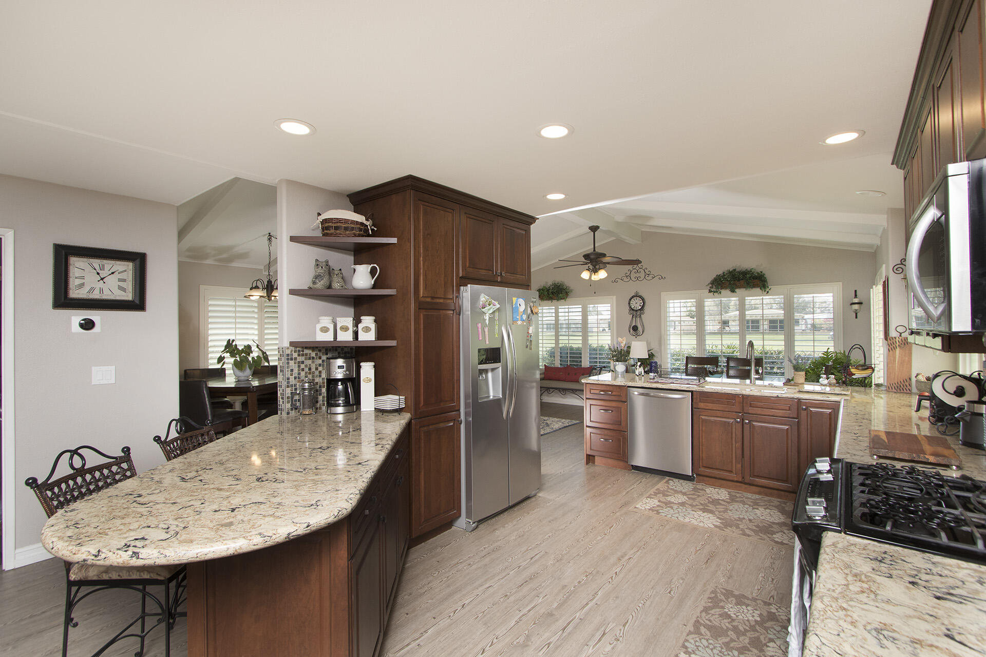 34649 Double Diamond Drive Thousand Palms, CA 92276 - Photo 28 of 42 a kitchen with refrigerator and chairs