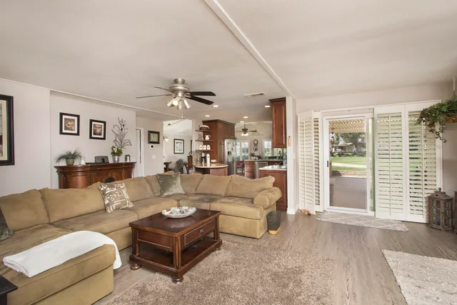 a kitchen with stainless steel appliances granite countertop a sink a stove and cabinets