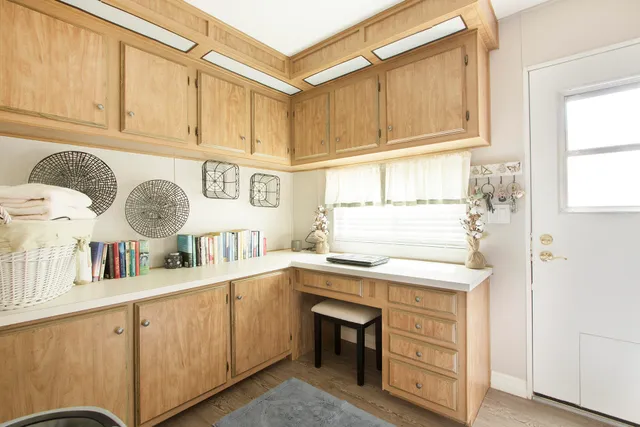 a view of a patio with a table chairs and a backyard