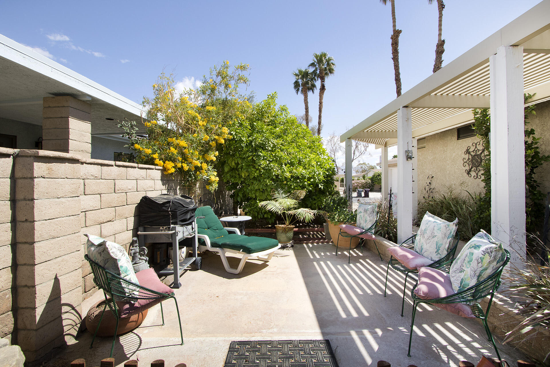 34649 Double Diamond Drive Thousand Palms, CA 92276 - Photo 37 of 42 a view of a patio with couple of chairs