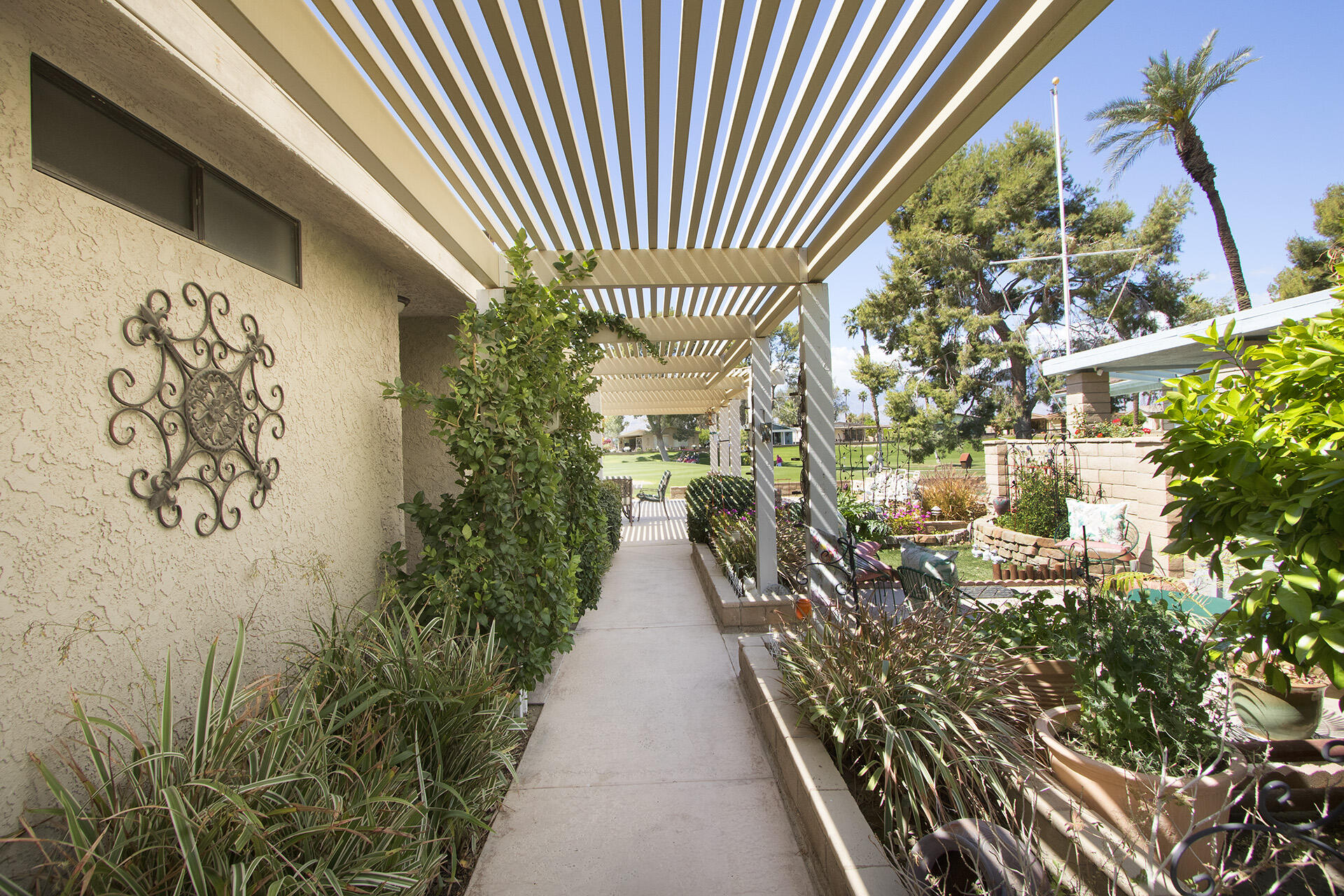 34649 Double Diamond Drive Thousand Palms, CA 92276 - Photo 38 of 42 a view of entryway with a flower pot