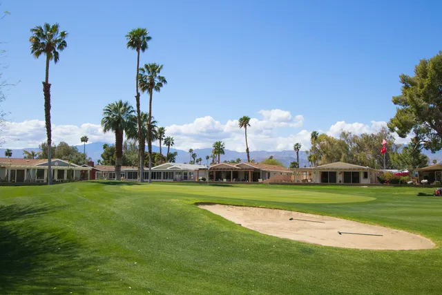 a view of a park with houses