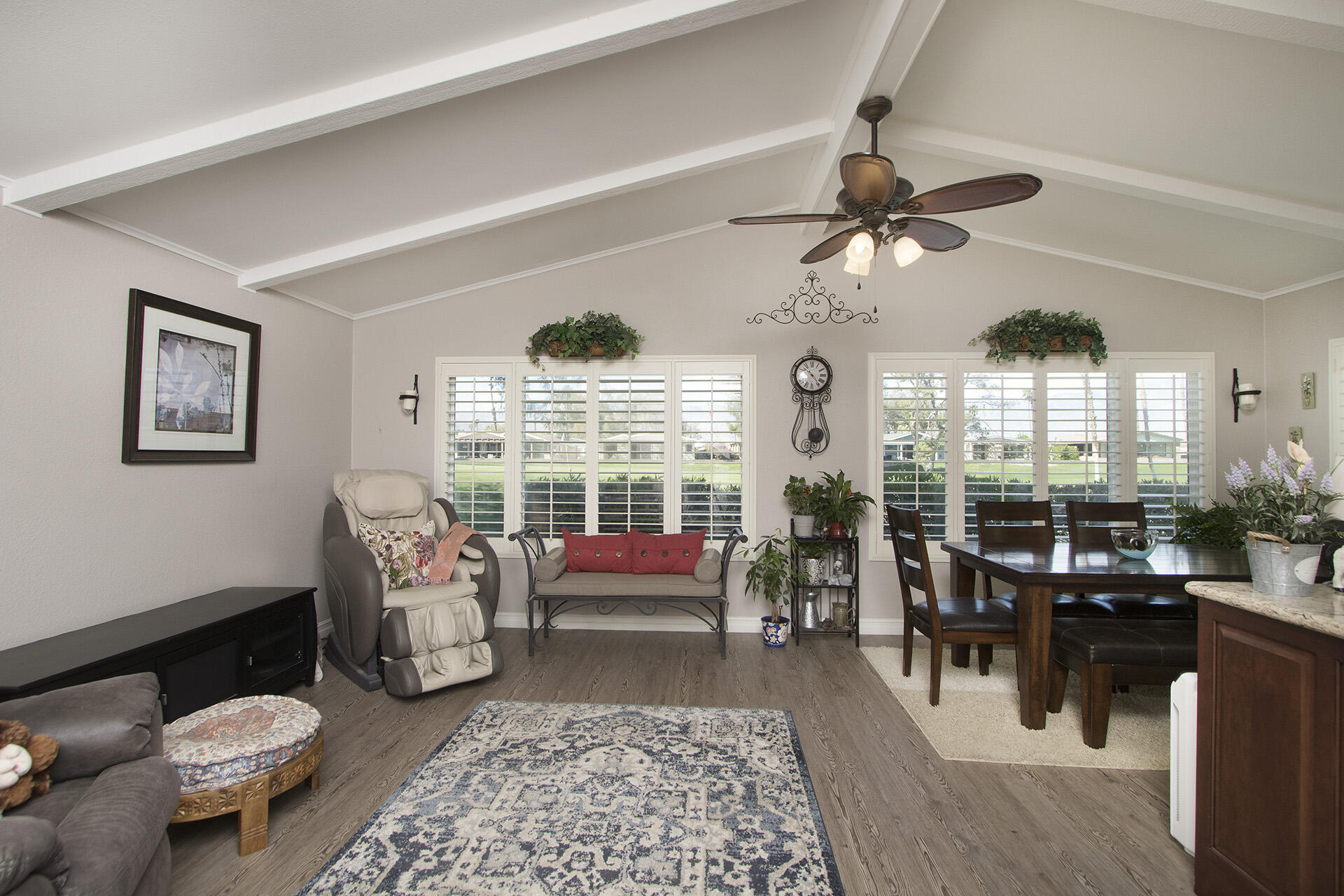 34649 Double Diamond Drive Thousand Palms, CA 92276 - Photo 6 of 42 a living room with patio furniture and a large window