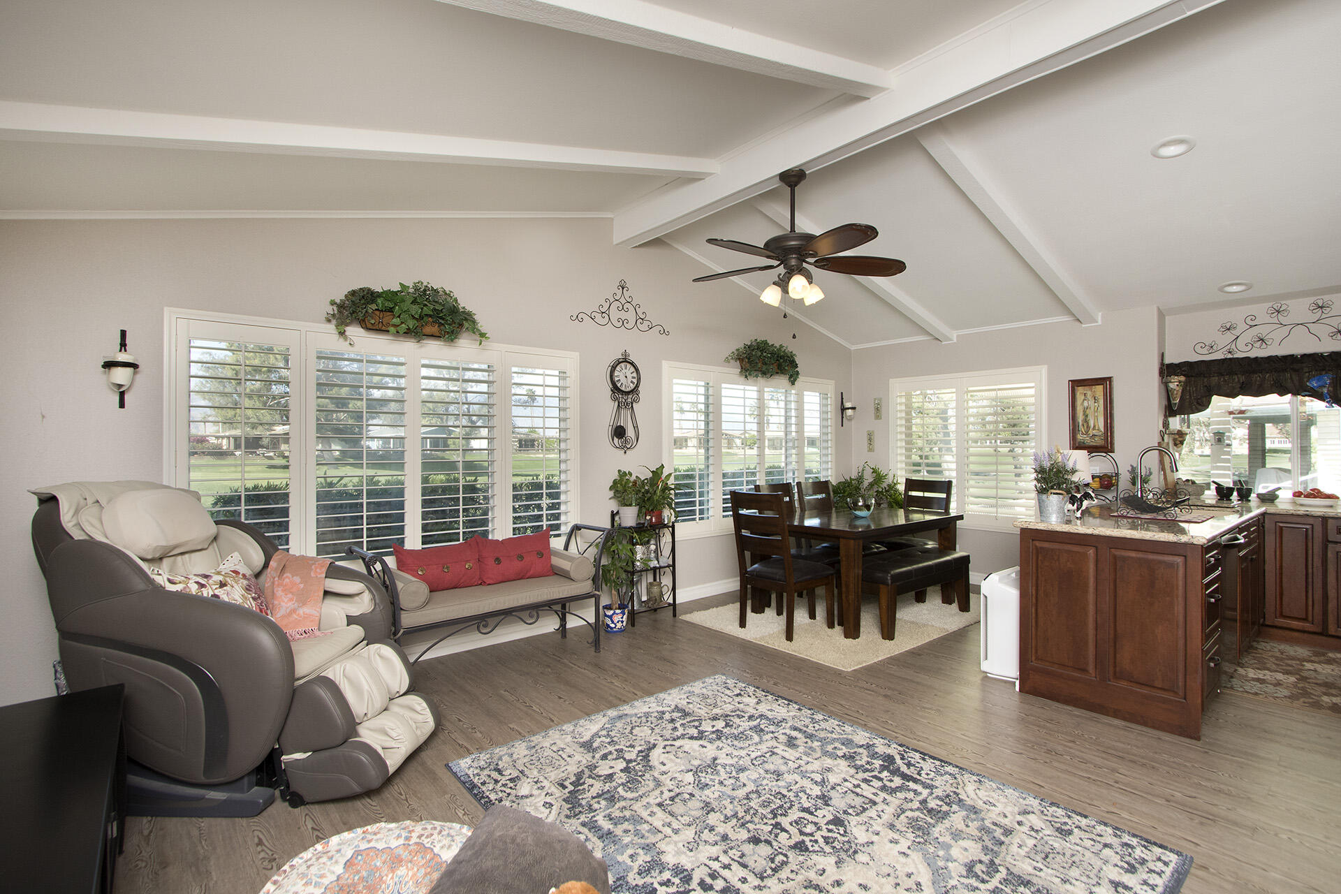 34649 Double Diamond Drive Thousand Palms, CA 92276 - Photo 7 of 42 a living room with furniture ceiling fan and a rug