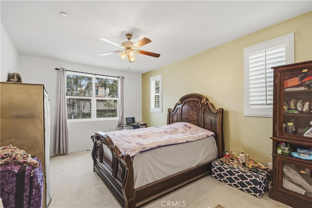 3380 Pine Ridge Loop Ontario, CA 91761 - Photo 13 of 37 a bedroom with a bed and a window