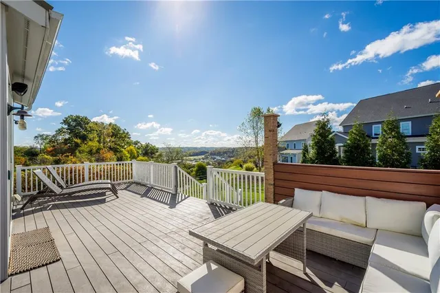 a view of a roof deck with couches