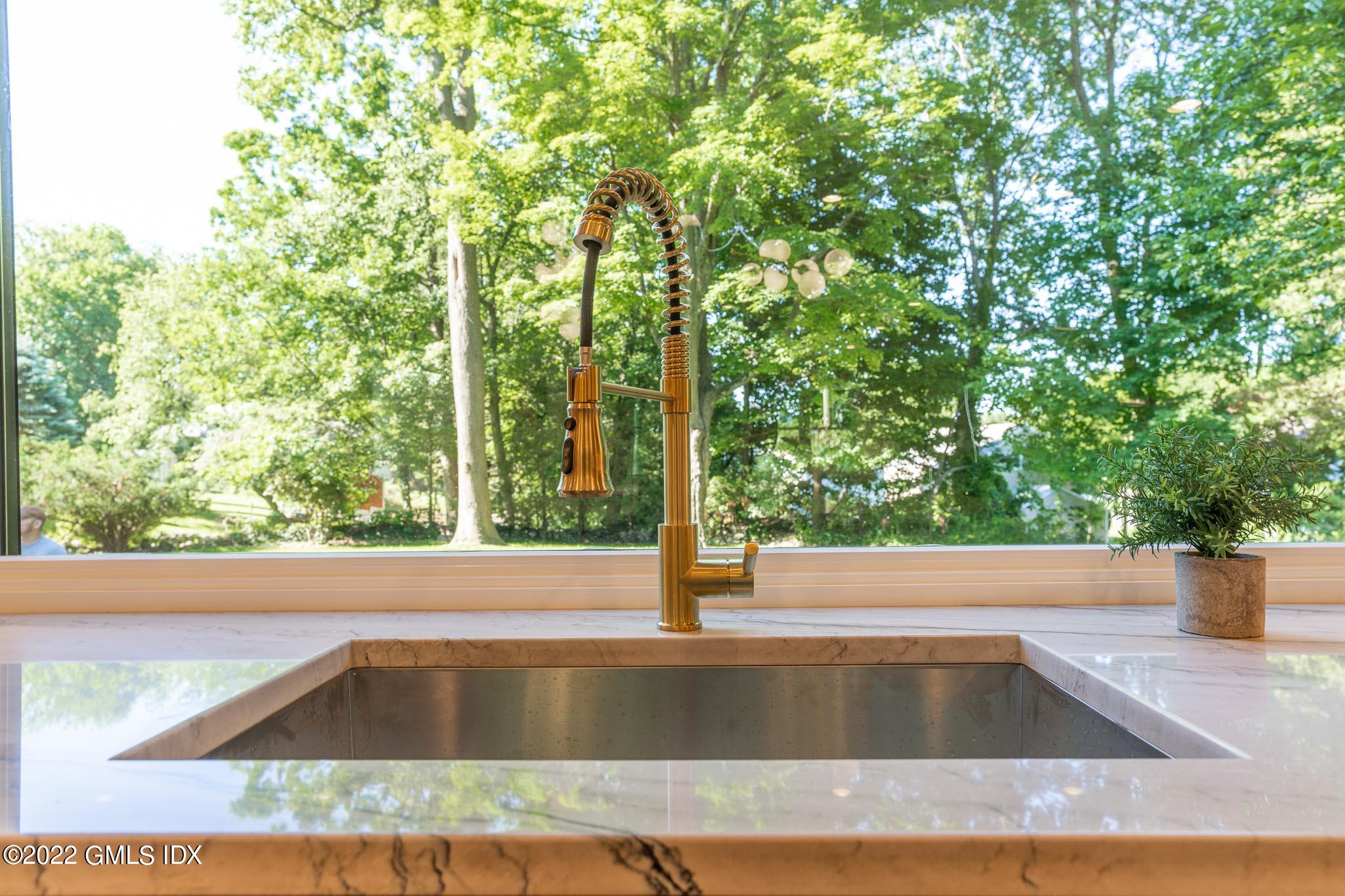 40 Halsey Drive Old Greenwich, CT 06870 - Photo 14 of 40 a view of a kitchen with a sink and large window