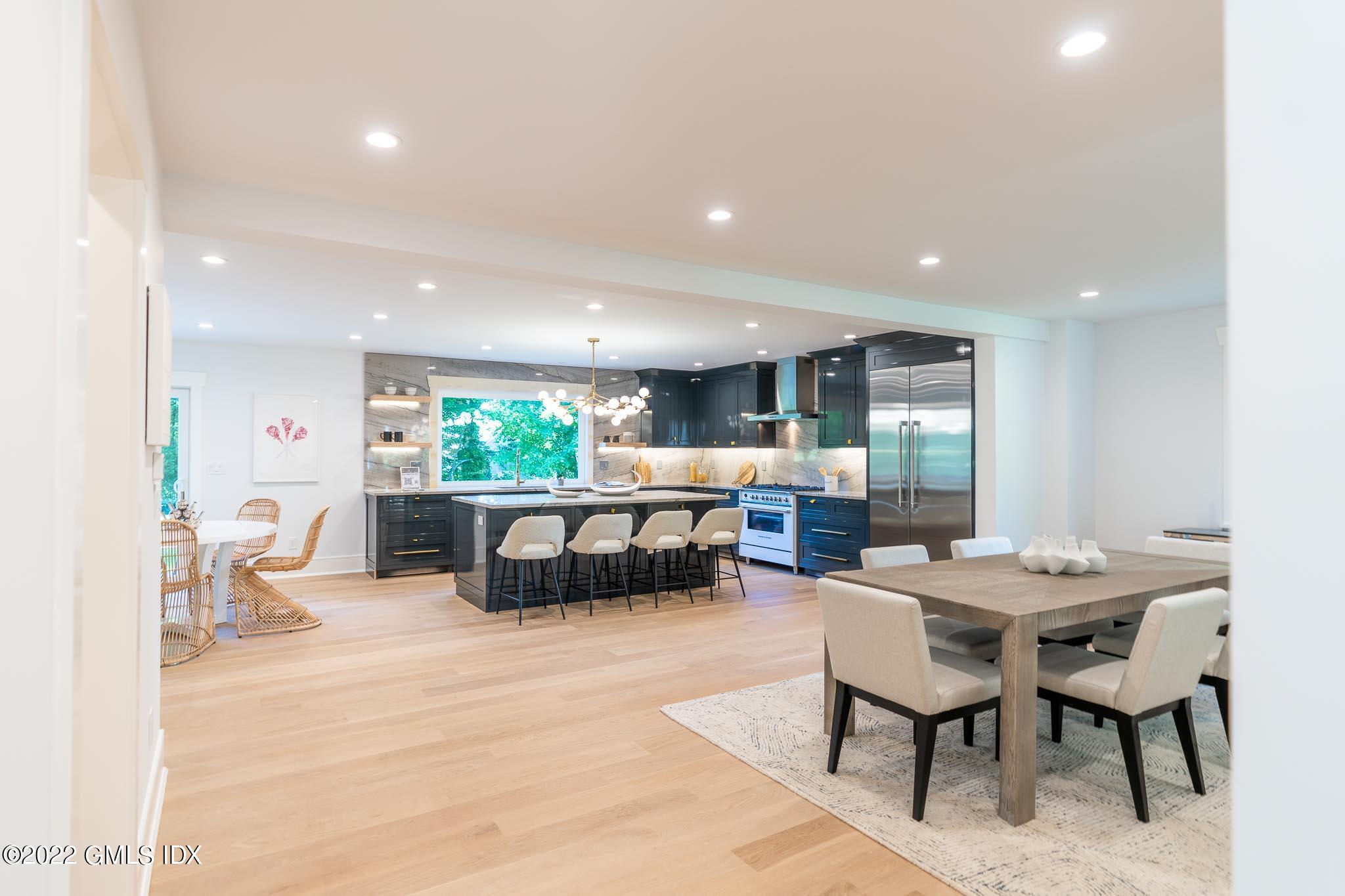 40 Halsey Drive Old Greenwich, CT 06870 - Photo 15 of 40 a kitchen with a table and chairs