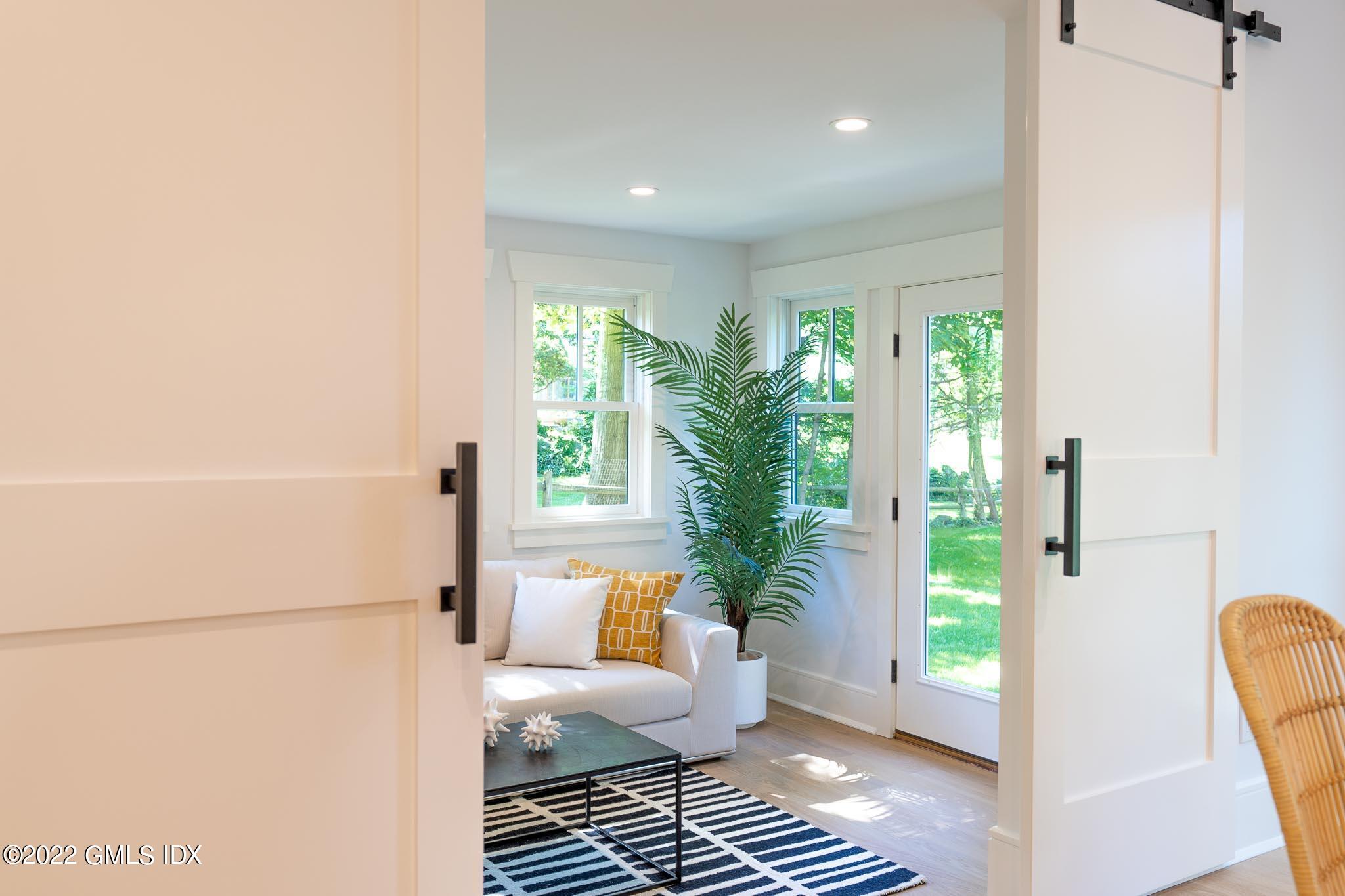 40 Halsey Drive Old Greenwich, CT 06870 - Photo 17 of 40 a living room with furniture and a potted plant