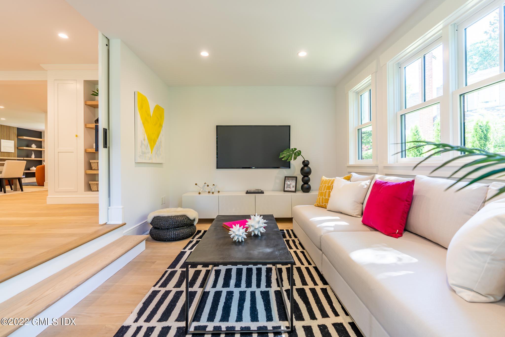 40 Halsey Drive Old Greenwich, CT 06870 - Photo 18 of 40 a living room with a couch and a flat screen tv