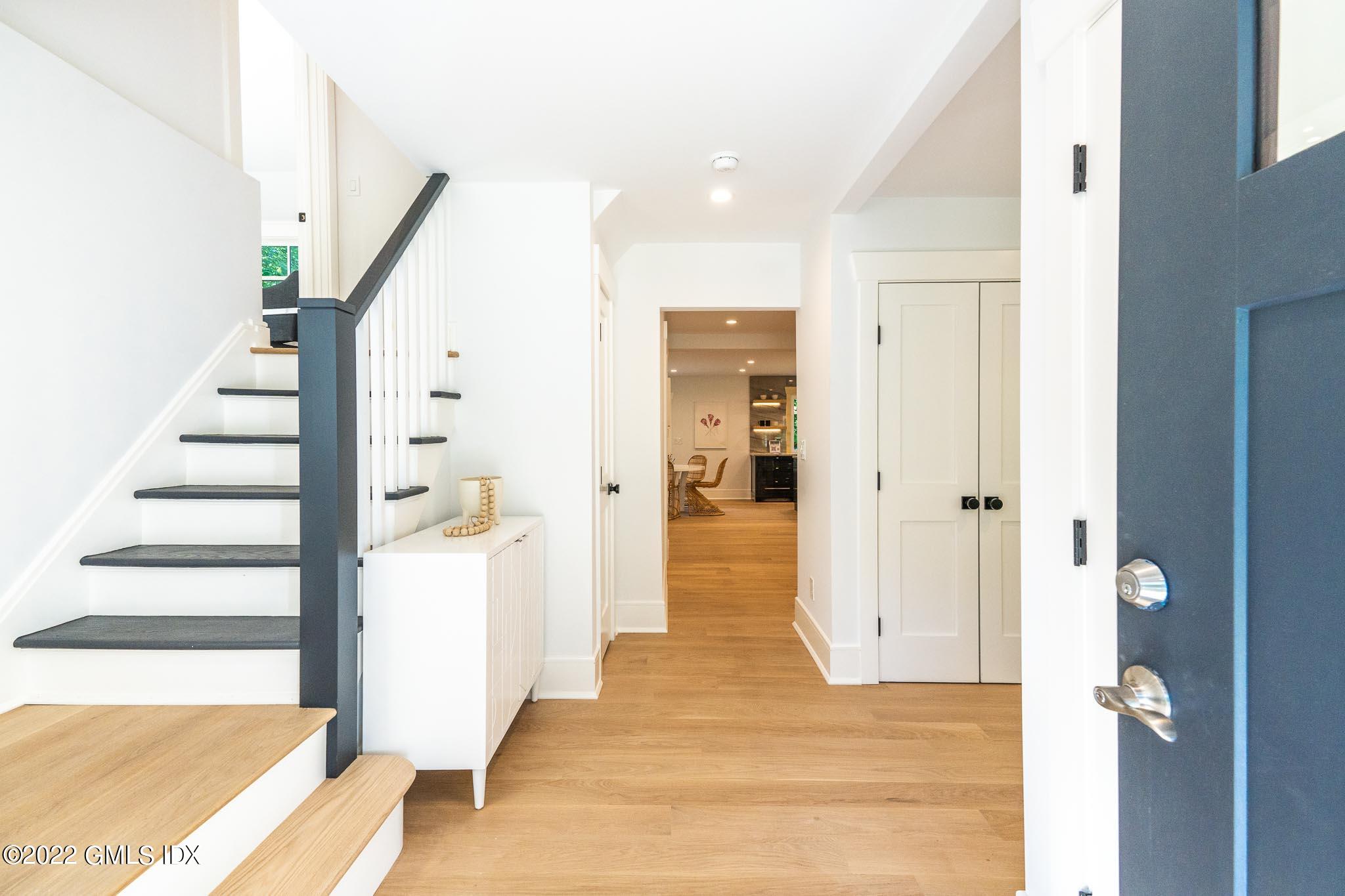 40 Halsey Drive Old Greenwich, CT 06870 - Photo 2 of 40 a view of a hallway with wooden floor and staircase