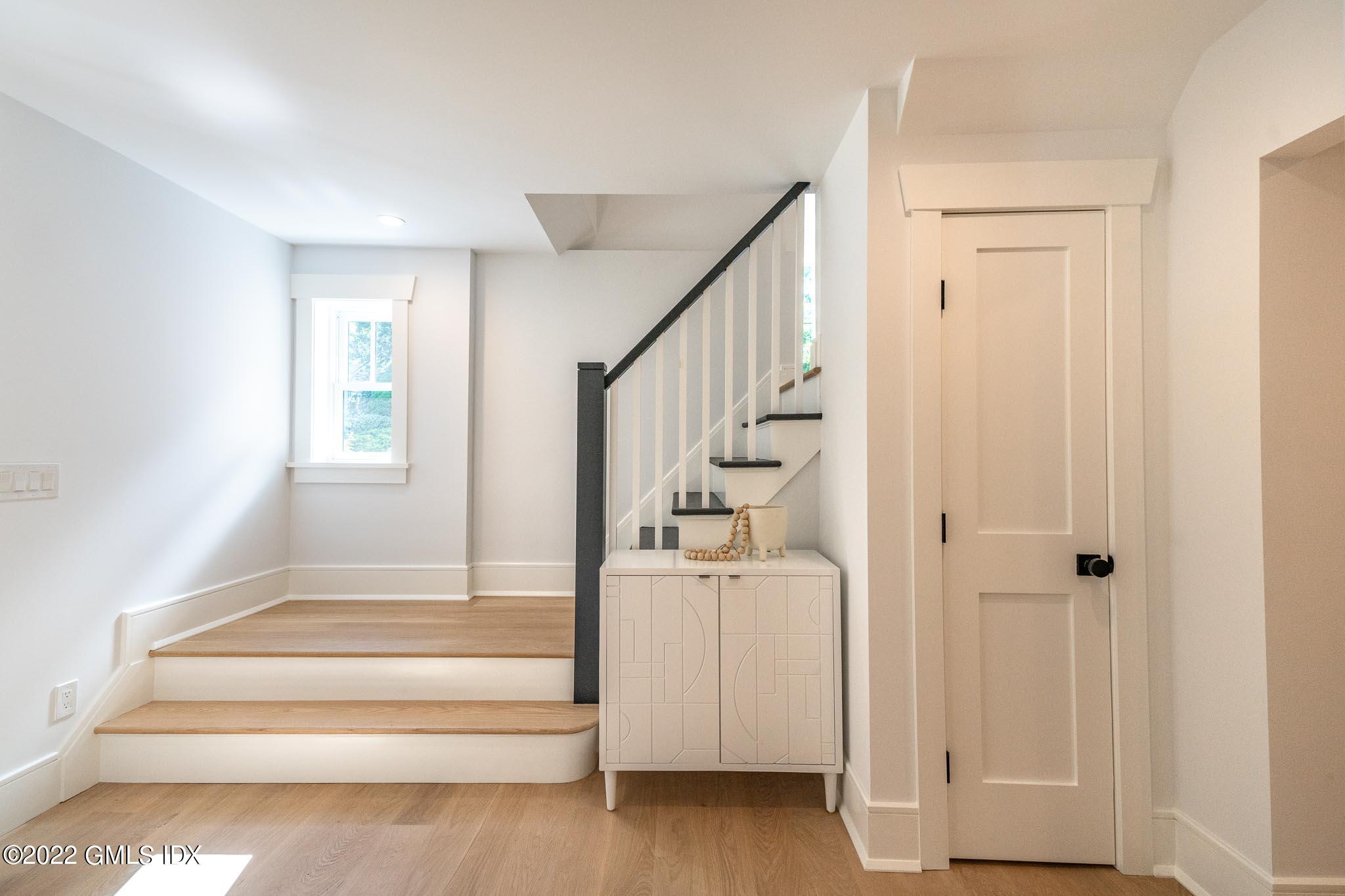 40 Halsey Drive Old Greenwich, CT 06870 - Photo 21 of 40 a view of entryway with wooden floor and front door