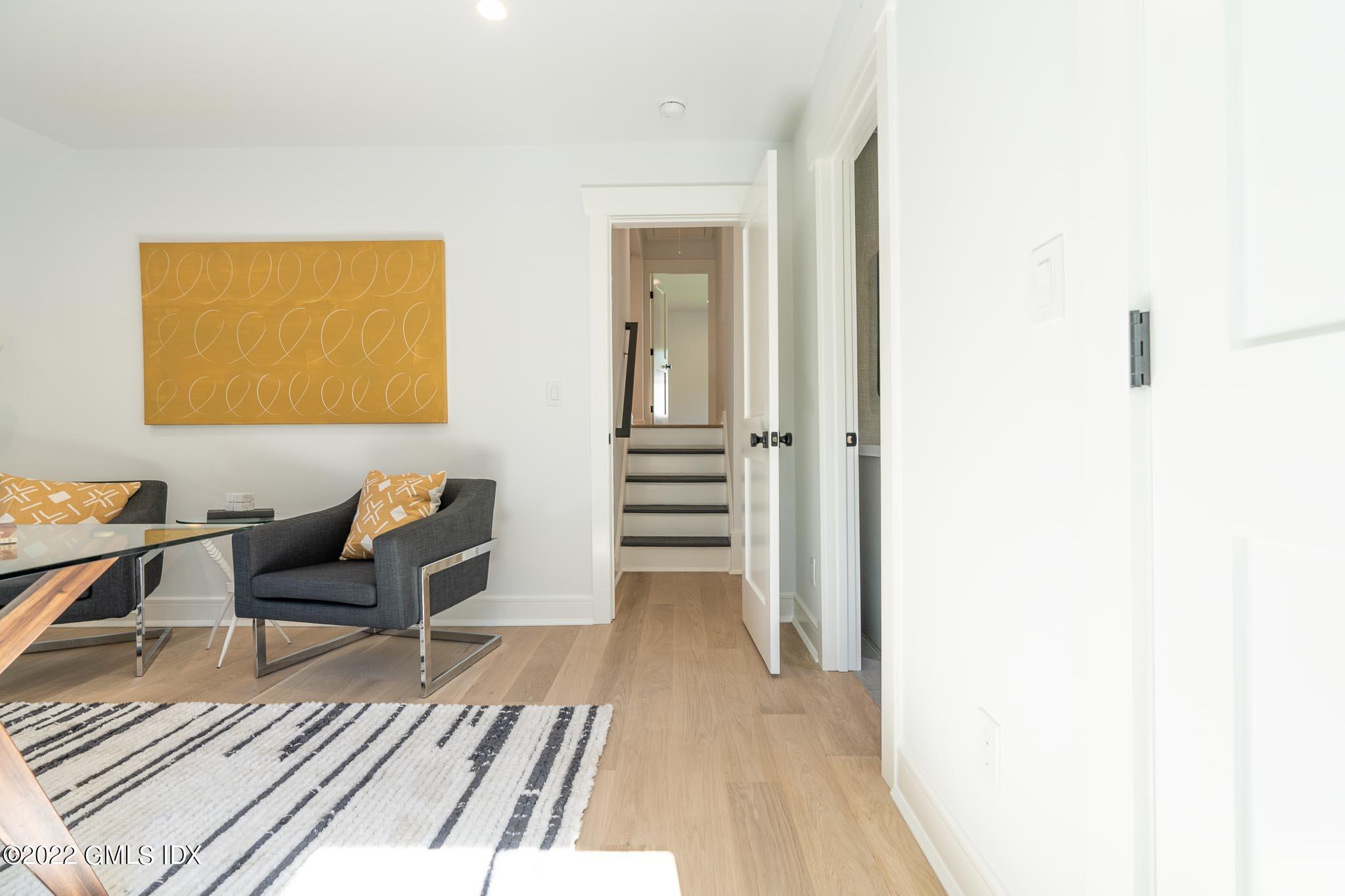 40 Halsey Drive Old Greenwich, CT 06870 - Photo 25 of 40 a living room with furniture and a wooden floor