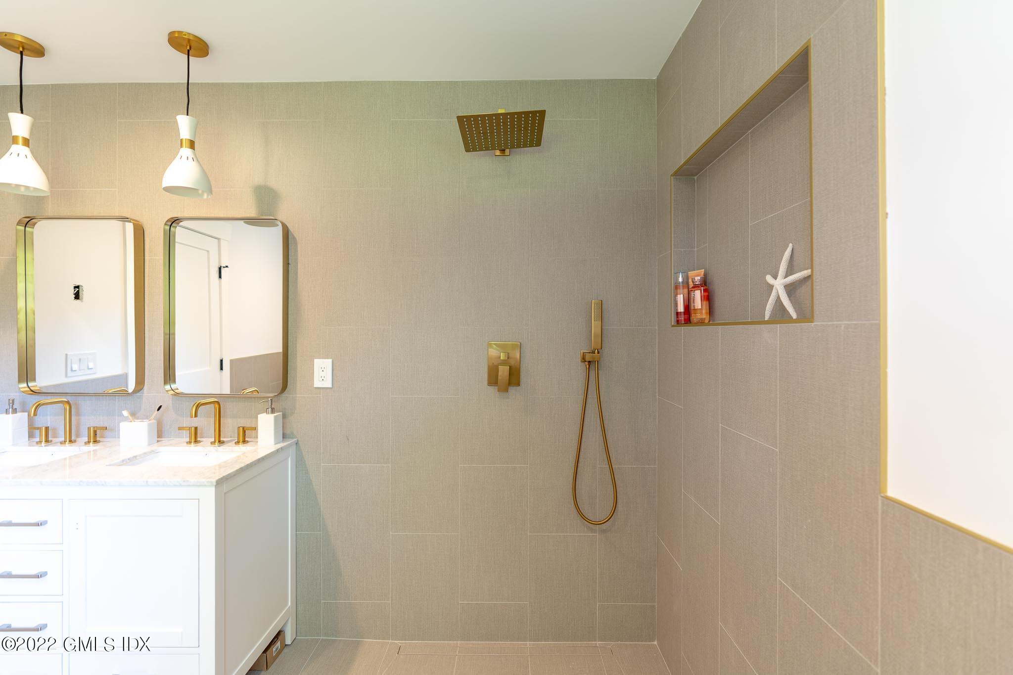 40 Halsey Drive Old Greenwich, CT 06870 - Photo 34 of 40 a bathroom with a sink and mirror