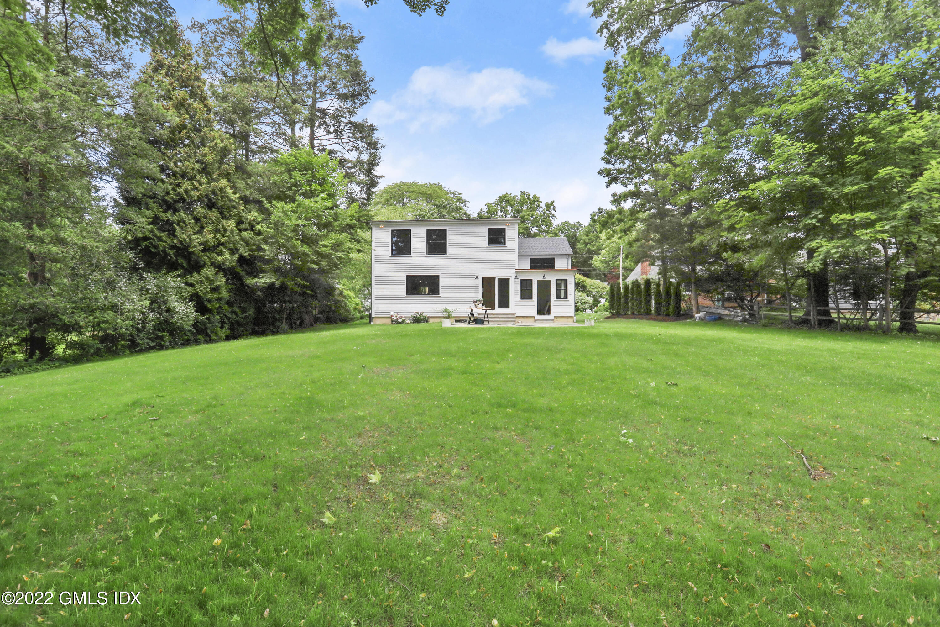 40 Halsey Drive Old Greenwich, CT 06870 - Photo 36 of 40 a view of a house with a big yard and large trees