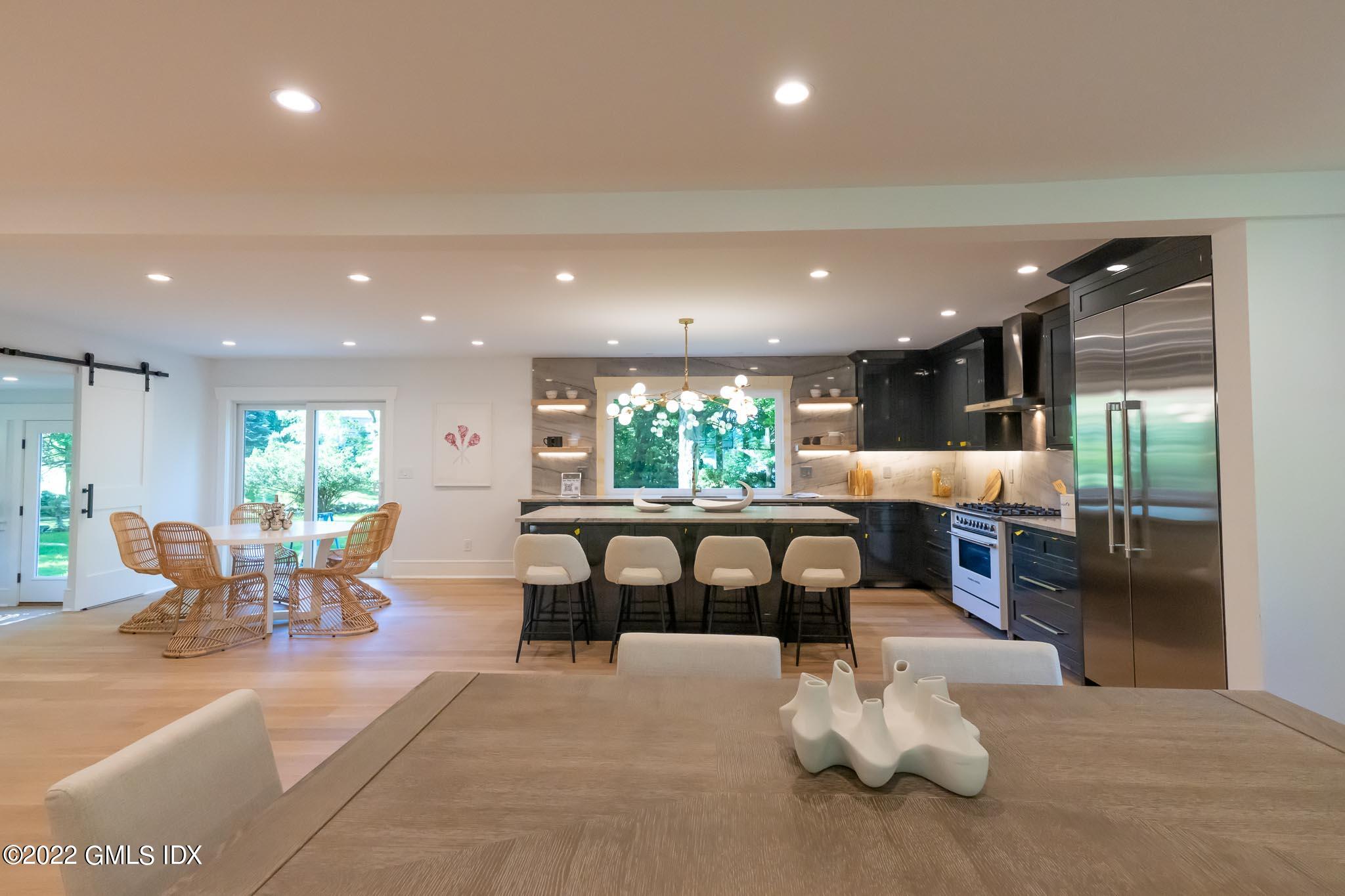 40 Halsey Drive Old Greenwich, CT 06870 - Photo 7 of 40 a dining room with furniture a window and a potted plant