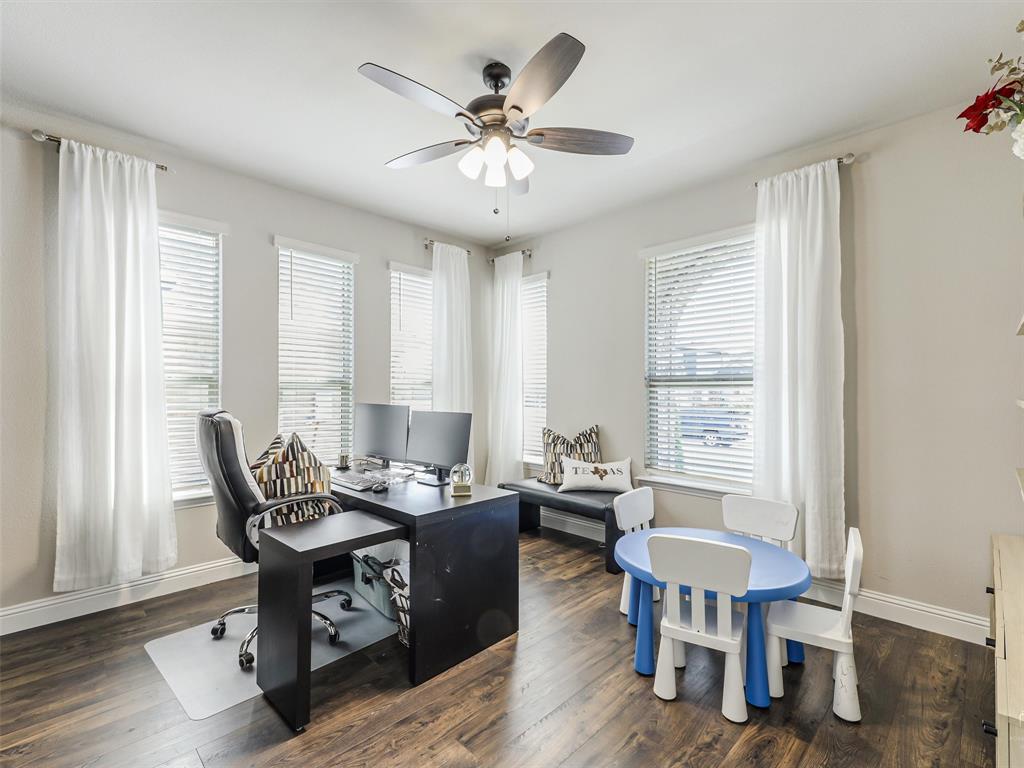 1216 Tree Shadow Lane Anna, TX 75409 - Photo 4 of 37 a dining room with furniture a chandelier and wooden floor