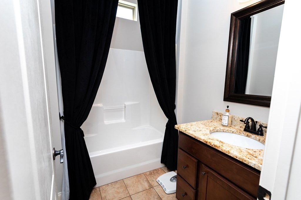 330 Talons Ridge Road Northwest Cleveland, TN 37312 - Photo 26 of 36 a bathroom with a sink and a mirror