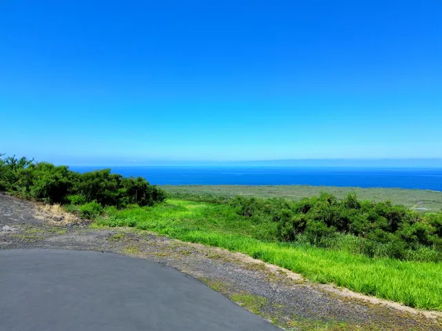 a view of a yard with an ocean