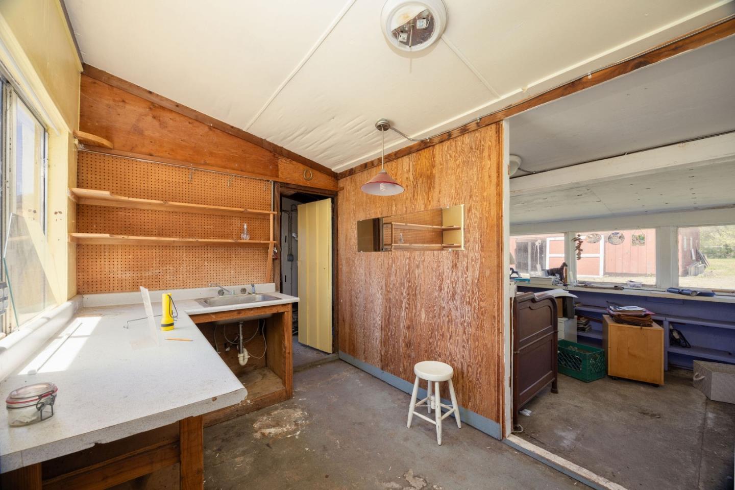 1650 Stage Road Pescadero, CA 94060 - Photo 38 of 55 a room with furniture a window and stainless steel appliances