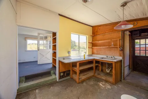 a bed room with a bed and a window