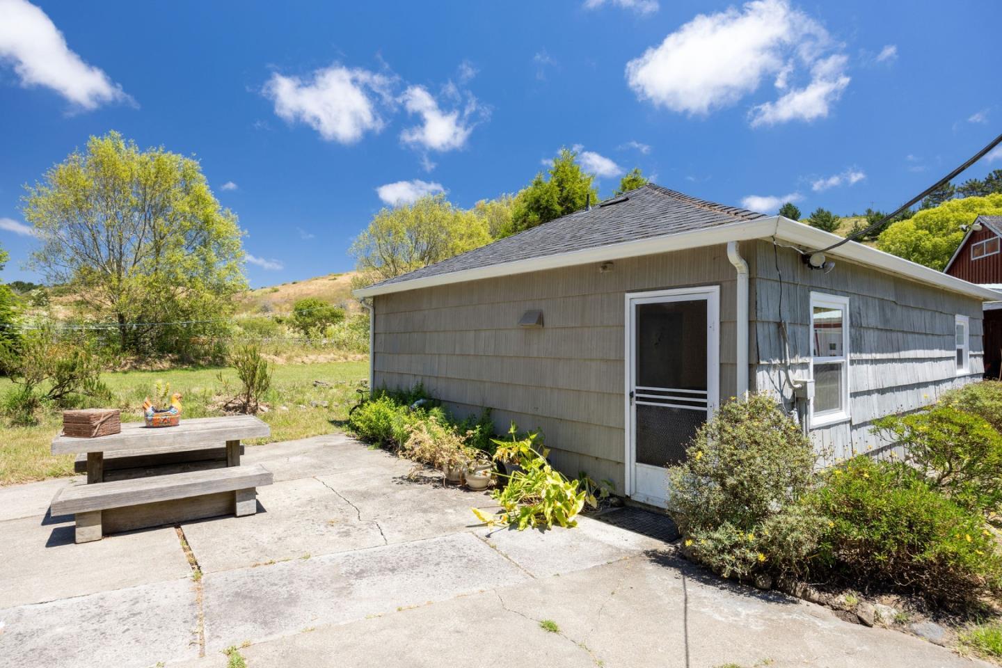 1650 Stage Road Pescadero, CA 94060 - Photo 40 of 55 a front view of a house with a yard