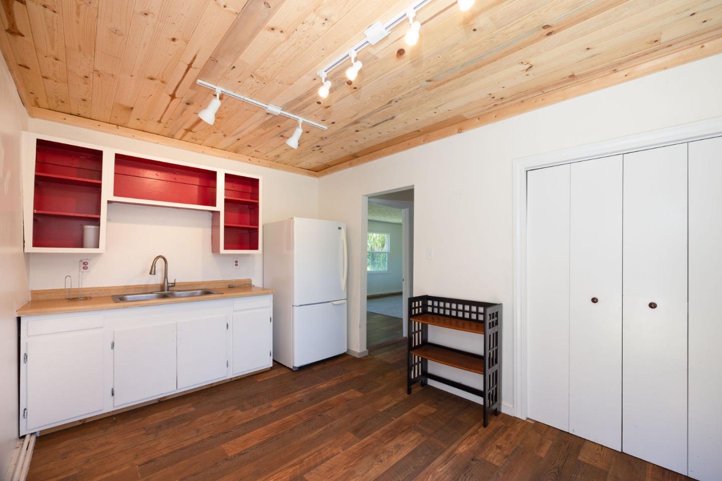 1650 Stage Road Pescadero, CA 94060 - Photo 41 of 55 a kitchen with cabinets and wooden floor