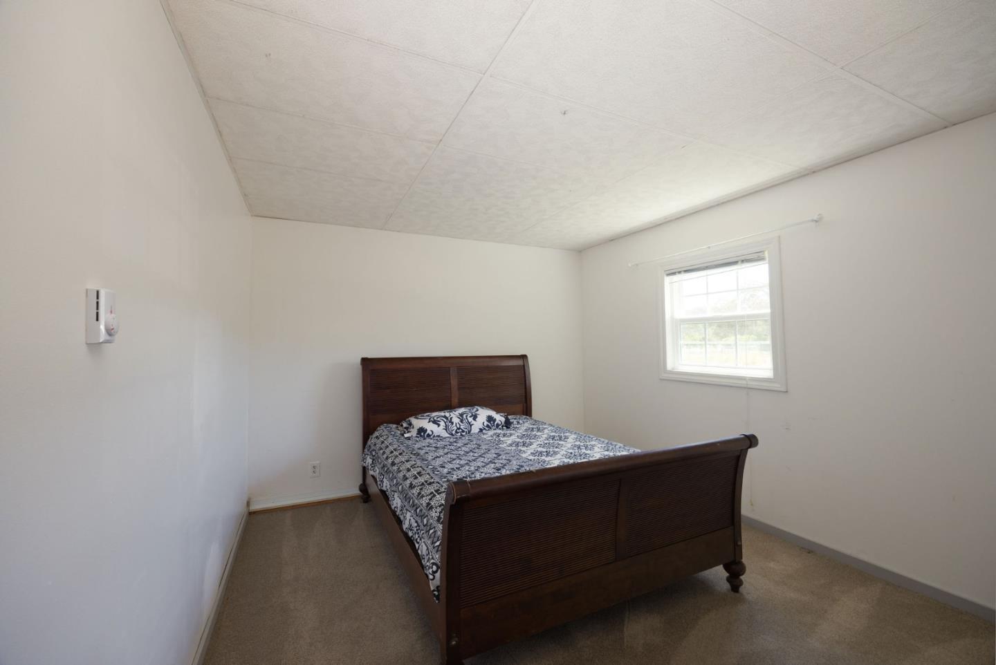 1650 Stage Road Pescadero, CA 94060 - Photo 42 of 55 a room with a bed and a window