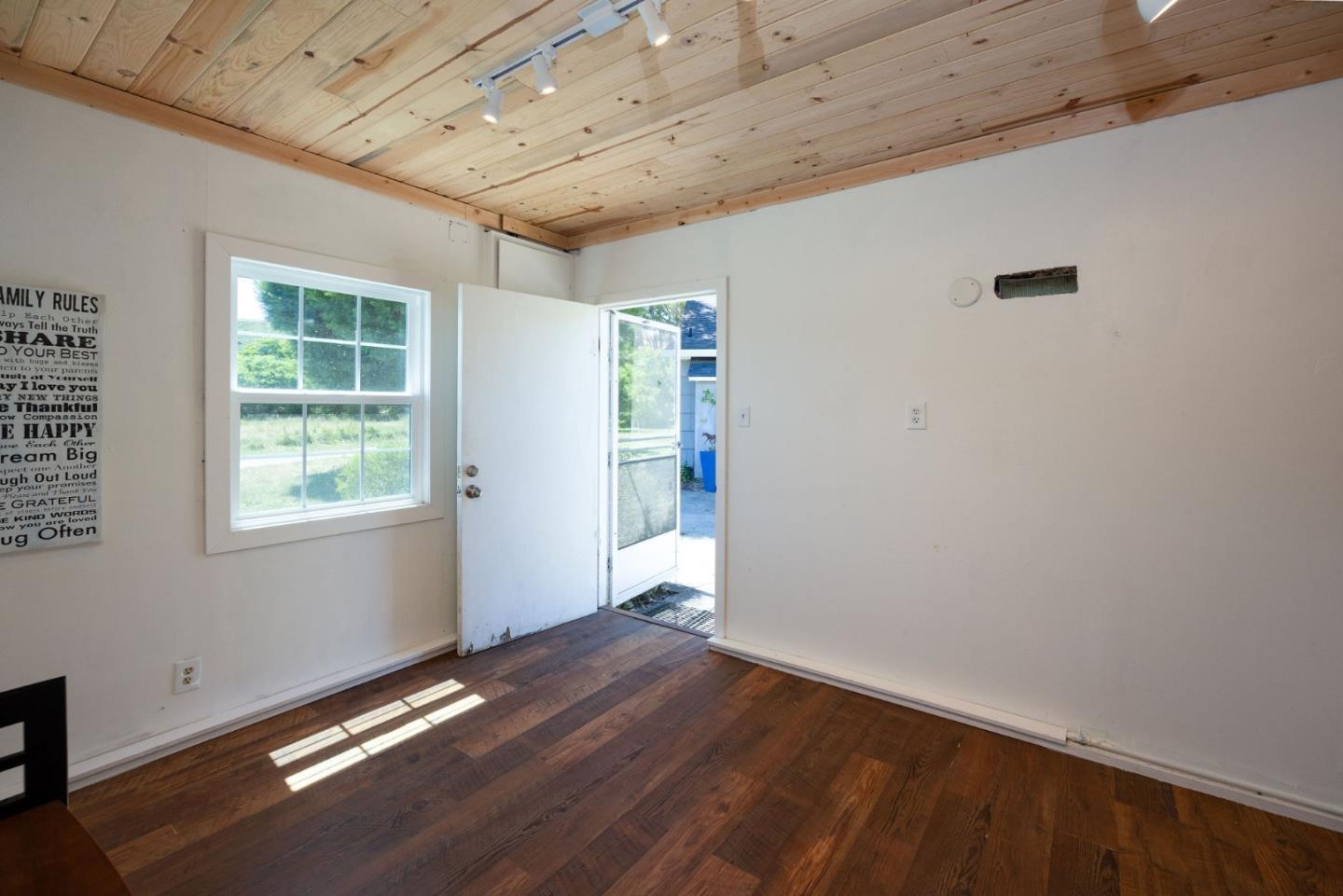1650 Stage Road Pescadero, CA 94060 - Photo 47 of 55 a view of an empty room with wooden floor and a window