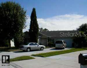 1553 Chepacket Street Brandon, FL 33511 - Photo 1 of 1 a view of street with parked cars