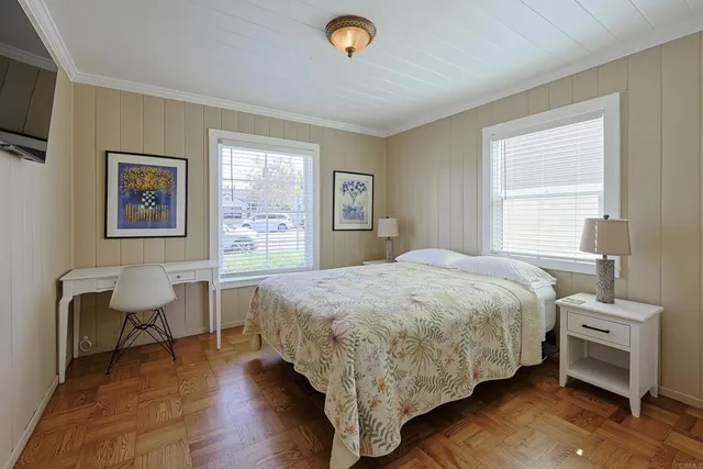 a bedroom with a bed and a chair