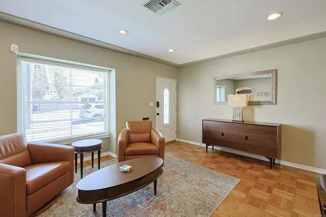 a living room with furniture and a window