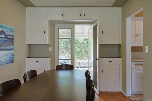 a kitchen with cabinets a sink and a window