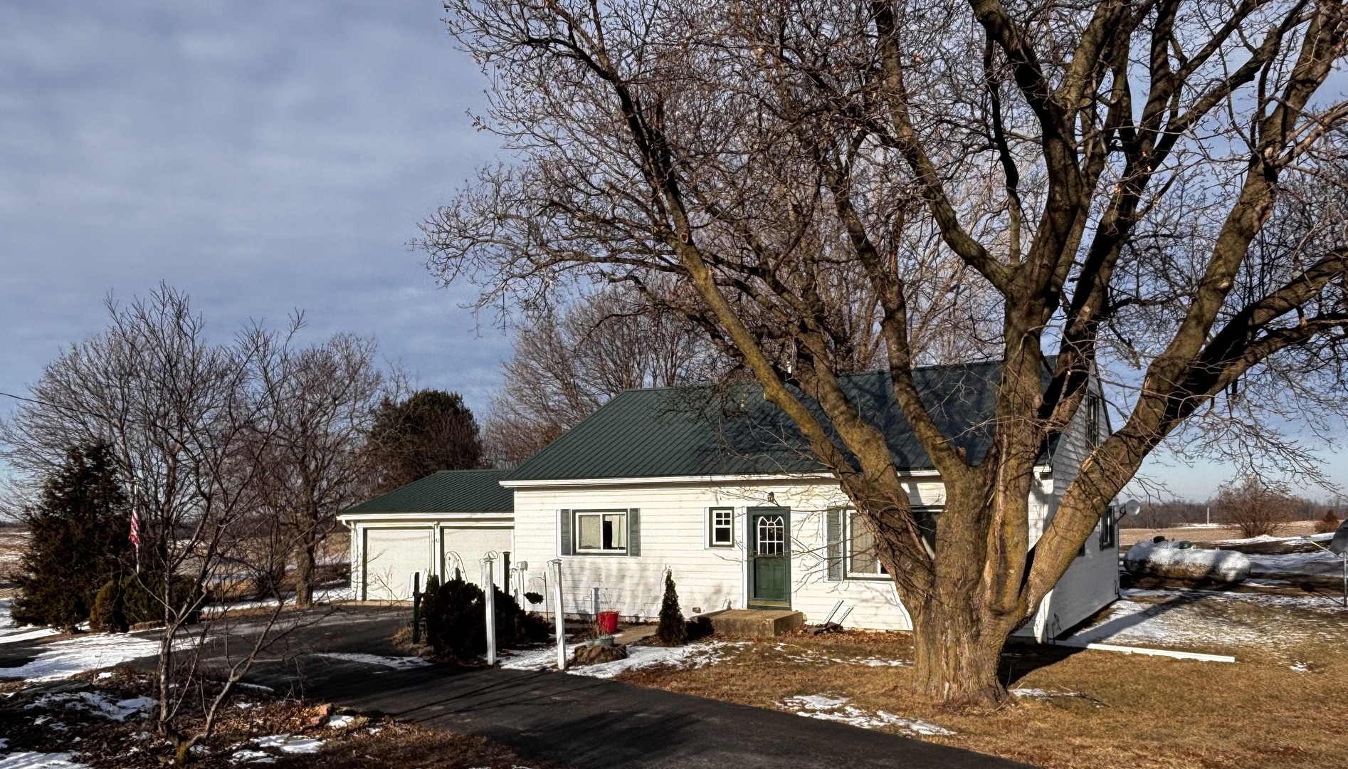 16319 Ideal Road Thomson, IL 61285 - Photo 1 of 15 a front view of a house with a yard