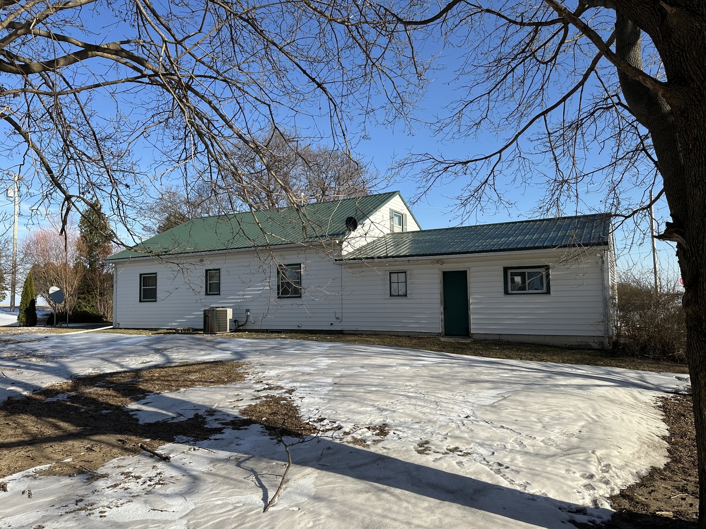16319 Ideal Road Thomson, IL 61285 - Photo 15 of 15 a house with trees in the background