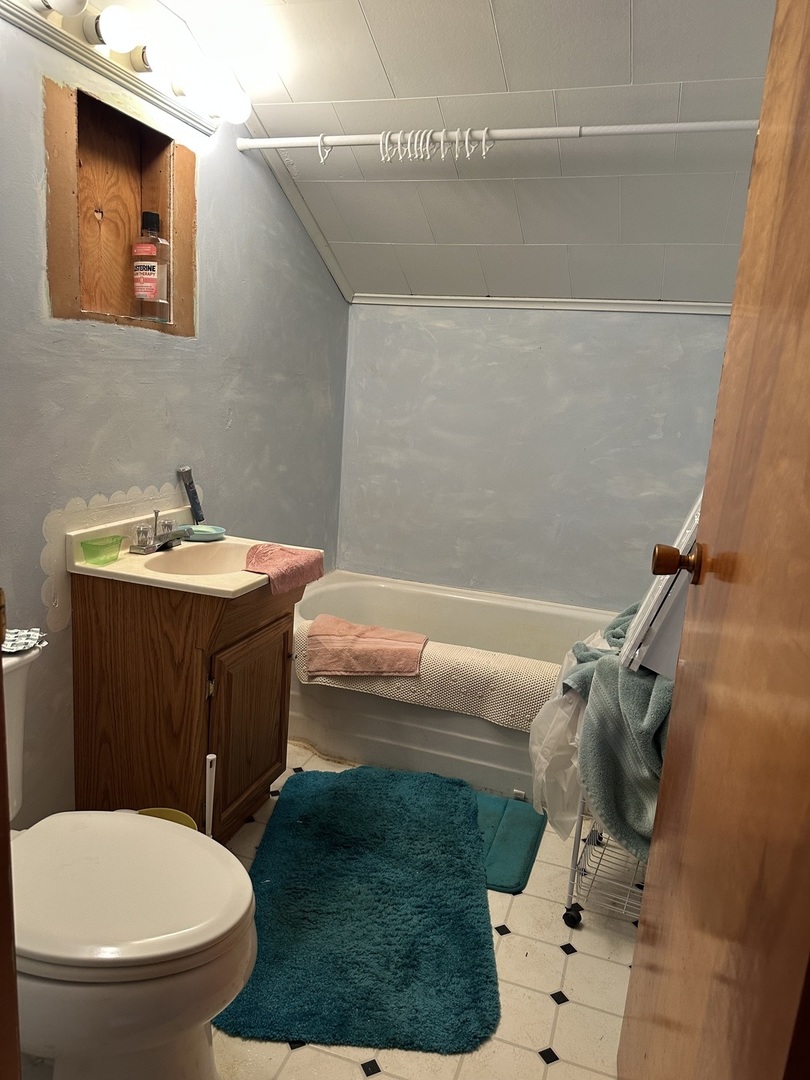 16319 Ideal Road Thomson, IL 61285 - Photo 10 of 15 a bathroom with a sink toilet and a mirror