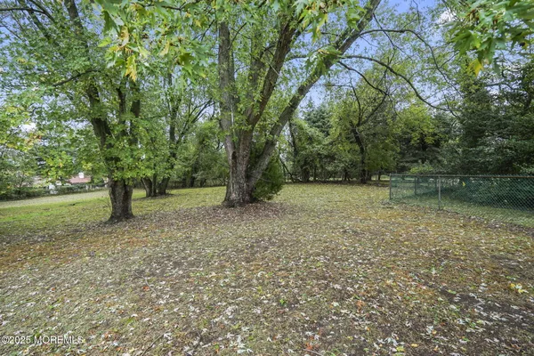 a view of outdoor space with deck and yard