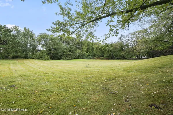 a view of a field with an outdoor space