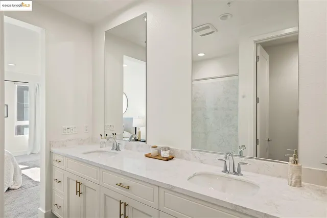 a bathroom with a double vanity sink mirror and double