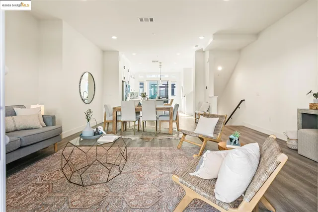 a living room with furniture chess floor and a rug