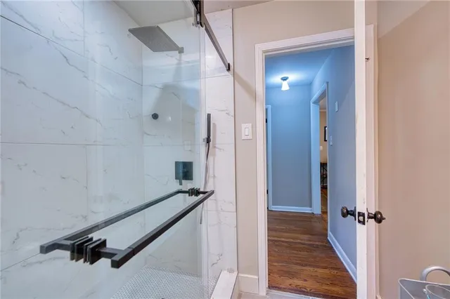 a view of a gallery with wooden floor