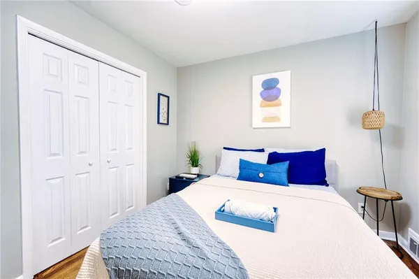 a bedroom with a large bed and a table