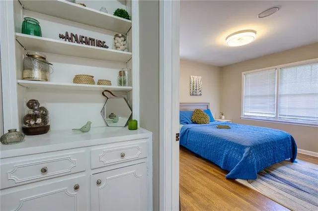 a bedroom with a bed and a dresser