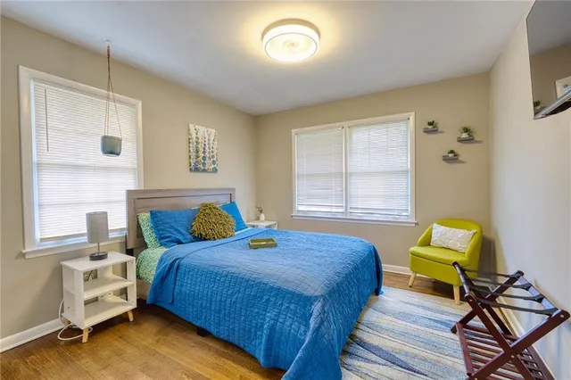 a bedroom with a bed and a chair