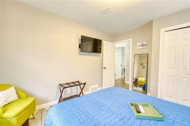 a bedroom with a bed and furniture