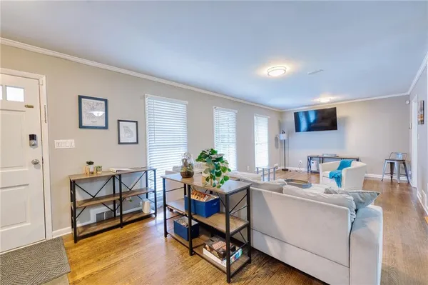 a work room with furniture and wooden floor
