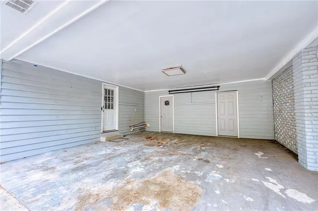 a view of a backyard with table and chairs