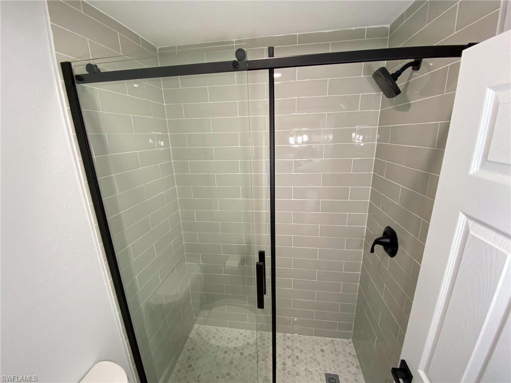 4180 Looking Glass Lane, Unit 4108 Naples, FL 34112 - Photo 11 of 21 Full bathroom featuring a stall shower