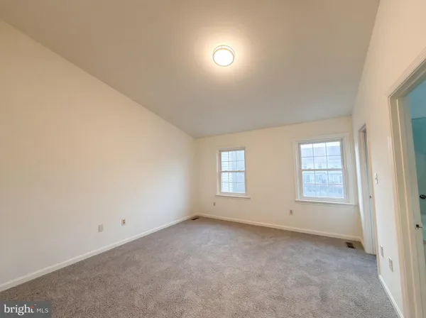 a bathroom with a toilet a sink and shower