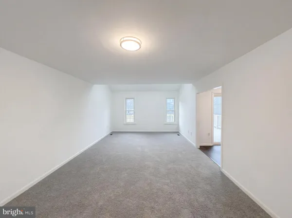 a view of a big room with windows and closet